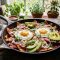 Chilaquiles Rojos – Mexican Breakfast with Red Salsa and Fried Eggs